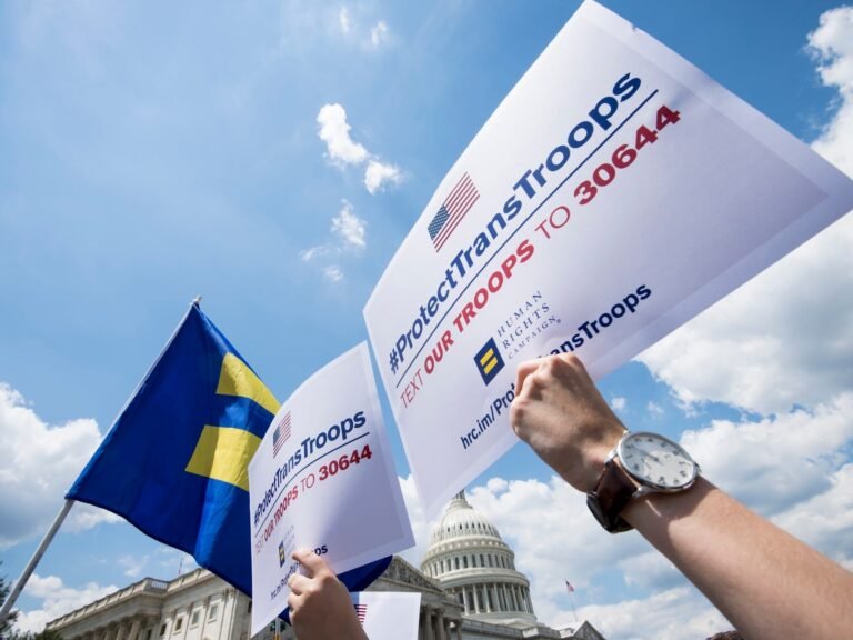 Transgender US troops can continue serving for now, in a major reversal for Trump
