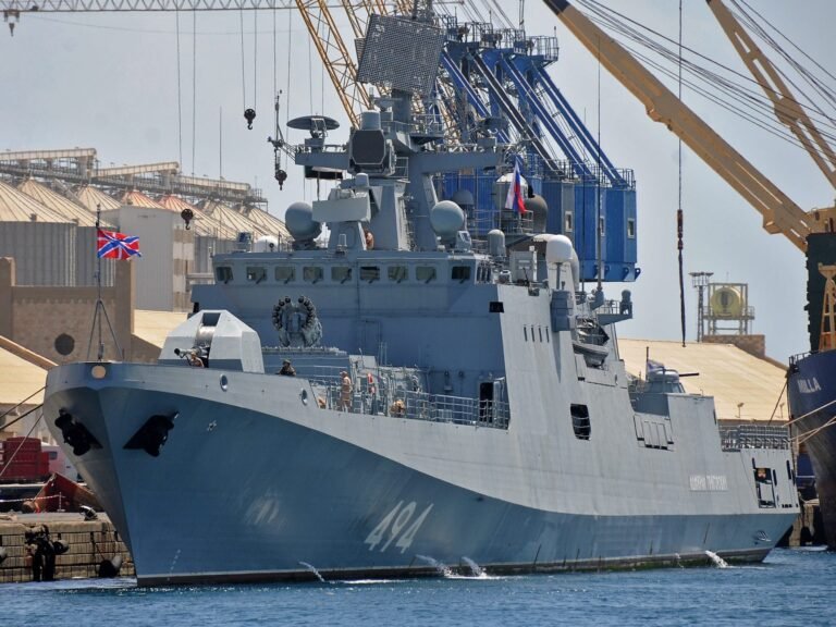 A Russian warship sailing between England and France fired warning shots at a British civilian yacht